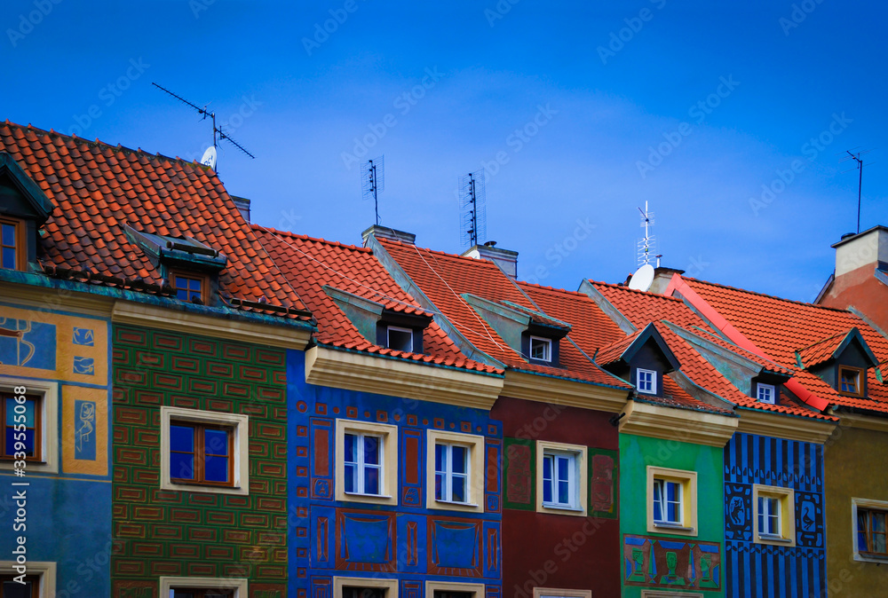 Fototapeta premium Narrow colored houses on the central square of a European medieval city. Poland, Poznan.