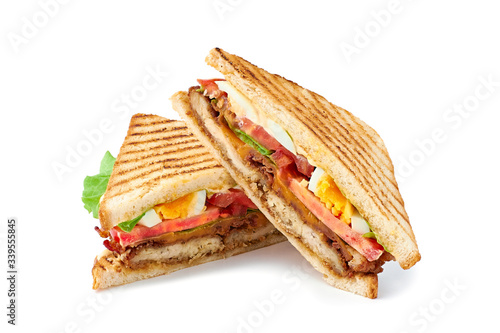 Two halves of juicy club sandwich on white