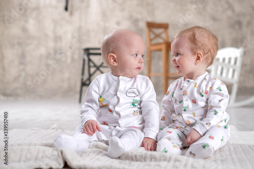 Beautiful little boy babies and girl are friends