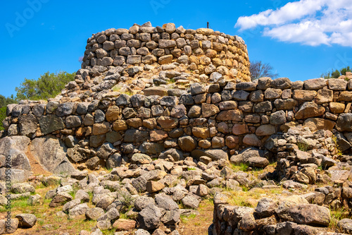Arzachena, Sardinia, Italy -Archeological ruins of Nuragic complex La Prisgiona - Nuraghe La Prisgiona - with stone main tower and preserved remaining of Neolithic fortress