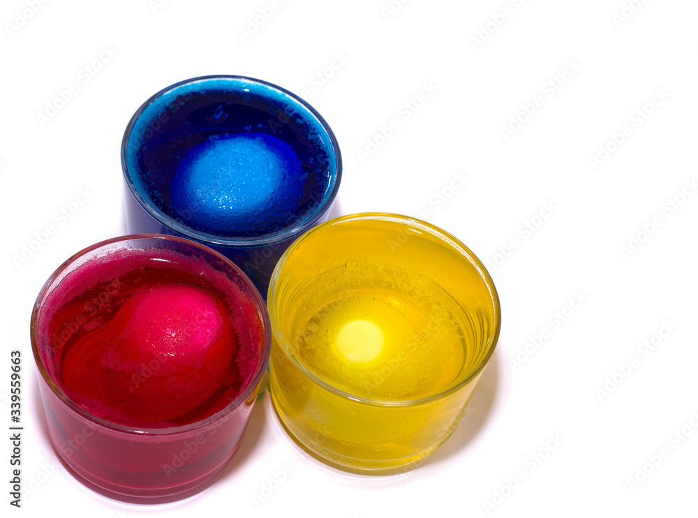 the Process of painting eggs in red, yellow, blue. Preparing for the Easter holiday. the Process of painting eggs in red, yellow, blue. Preparing for the Easter holiday.