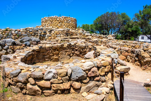 Arzachena, Sardinia, Italy - Archeological ruins of Nuragic complex La Prisgiona - Nuraghe La Prisgiona - with stone main tower and preserved remaining of Neolithic fortress photo