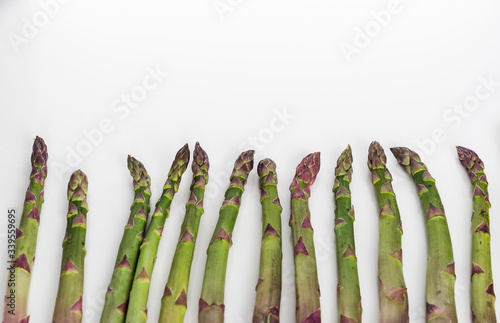 Green asparagus on white background with copy space