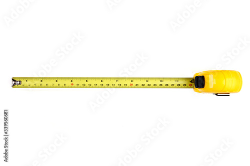 Yellow measuring tape isolated on white background, Top View. 12 in.