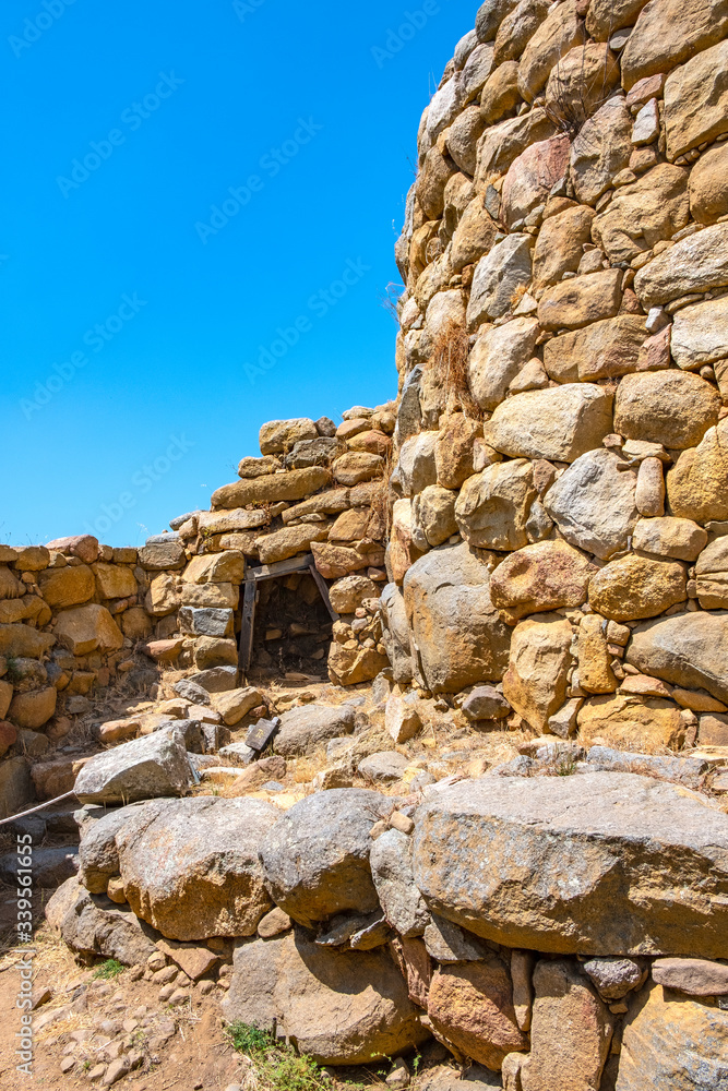 Arzachena, Sardinia, Italy - Archeological ruins of Nuragic complex La Prisgiona - Nuraghe La Prisgiona - with auxiliary entrance to stone tower of Neolithic fortress