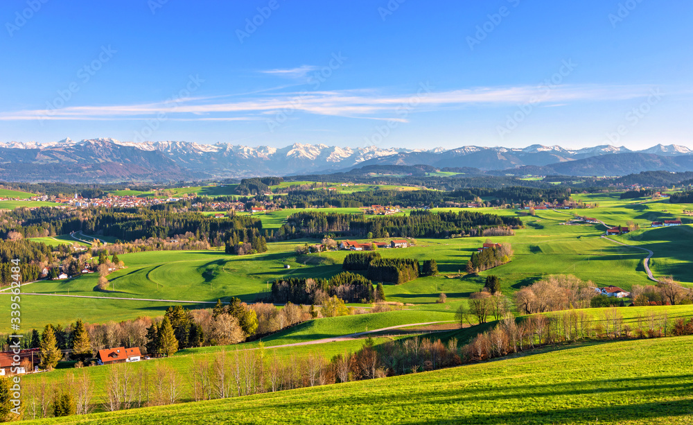 Panorama landscape with mountains and meadows in spring. Allgäu, Bavaria, Germany Panorama landscape with mountains and meadows in spring. Allgäu, Bavaria, Germany