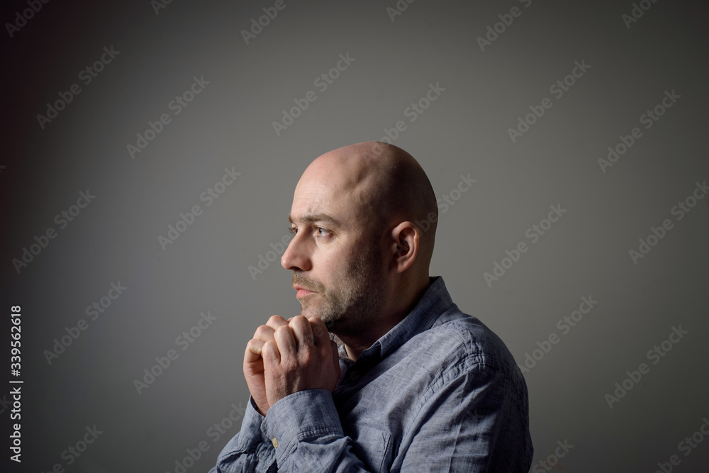 portrait of depressed sad bald man portrait of depressed sad bald man