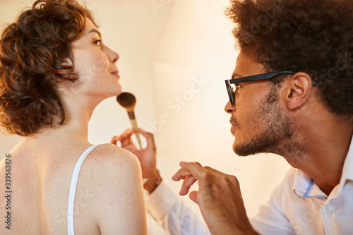 Make-up artist make-up model for photo shoot photo