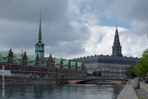 Kopenhagen, a colourful danish city, right at the seefront. The left tower is the stock exchange and the right tower is the famous church 'Christiansborg' of the capital of Denmark. photo