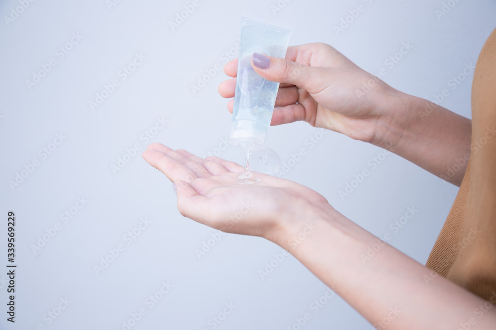 Close up view of woman antibacterial antiseptic gel in hand on white isolate Close up view of woman antibacterial antiseptic gel in hand on white isolate
