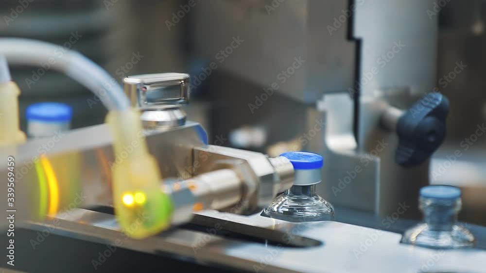 Automated tape for creating packaging and filling vials and bottles with medical medicines for the treatment of patients. Health care, medicine, coronovirus. Automated tape for creating packaging and filling vials and bottles with medical medicines for the treatment of patients. Health care, medicine, coronovirus.