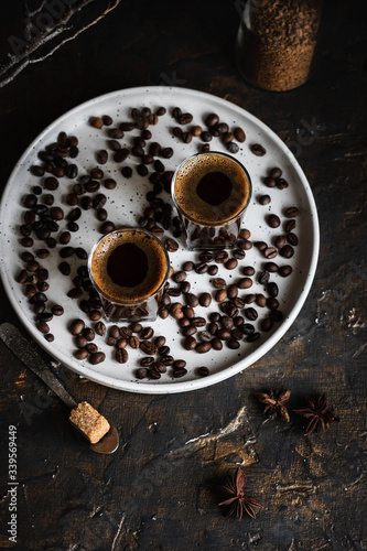 Espresso coffee in two glasses. Dark background. Dark style © ekatherina