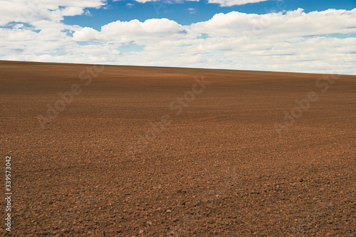 large plowed field against the sky