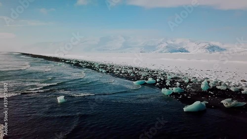 Ice with black sand beach at Jokulsarlon beach Diamond beach in Iceland. Aerial view