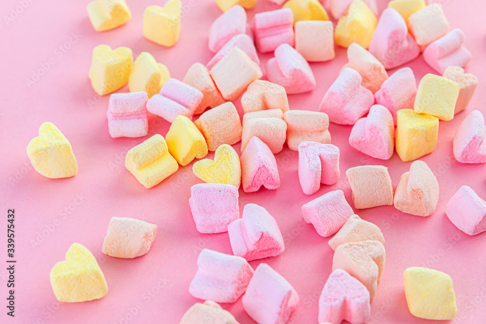 Colorful, light pink, yellow and peach love hearts on a pink background. Valentine's day wallpaper, festive background. Soft focus. Colorful, light pink, yellow and peach love hearts on a pink background. Valentine's day wallpaper, festive background. Soft focus.