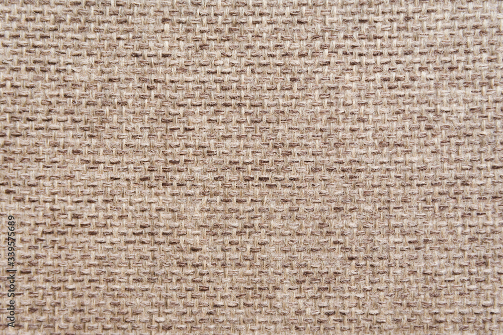 Pattern of a decorative beige sackcloth or burlap cloth. Close up view. Materials concept. Pattern of a decorative beige sackcloth or burlap cloth. Close up view. Materials concept.