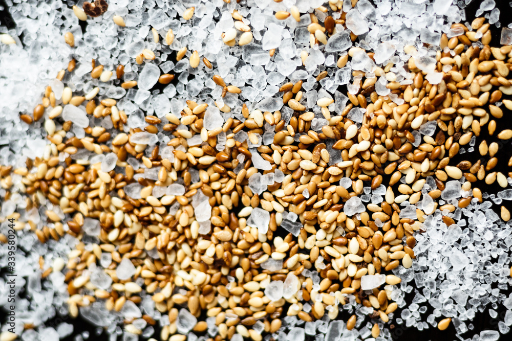beautiful mixture of sesame and sea salt on a black background beautiful mixture of sesame and sea salt on a black background