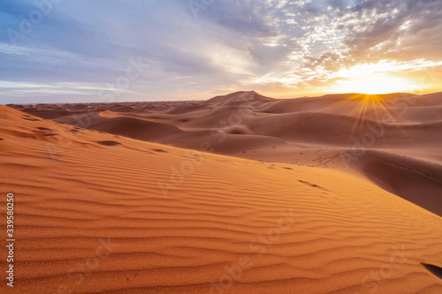 Beautiful sunset over sand dunes of Sahara Desert, Africa