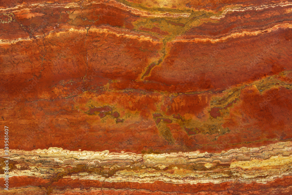 Natural stone in the colors of a lush lava with a white vein called Travertin Rosso