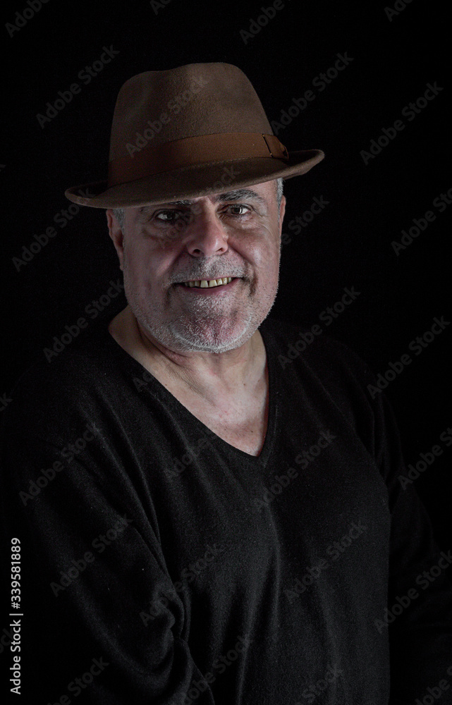 Portrait of mature man with beard on dark background Portrait of mature man with beard on dark background