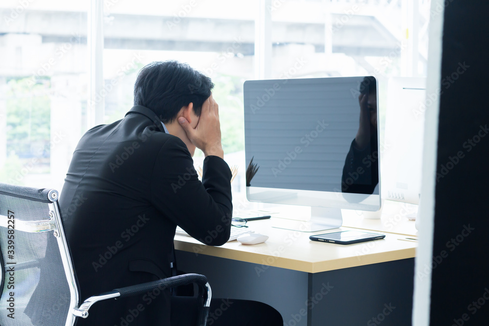 Portrait of young asian business take action have strain and focusing computer monitor to find idea for business finance concept Portrait of young asian business take action have strain and focusing computer monitor to find idea for business finance concept
