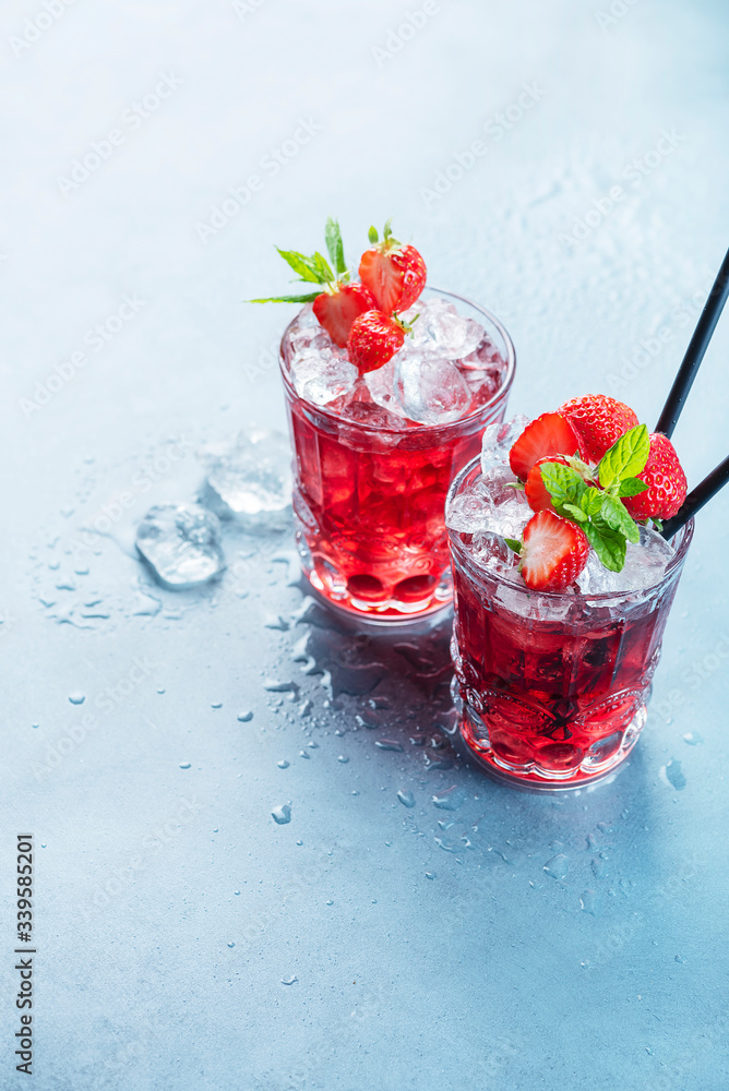 Red cocktail with ice and mint