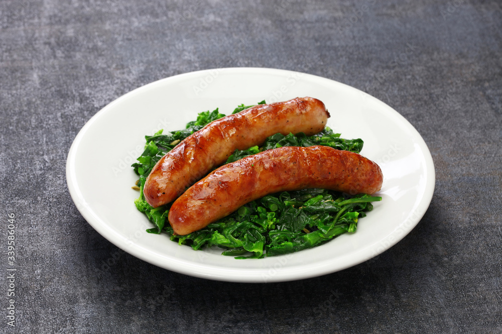 salsiccia e cime di rapa, sausage and braised tunip greens, southern italian cuisine salsiccia e cime di rapa, sausage and braised tunip greens, southern italian cuisine