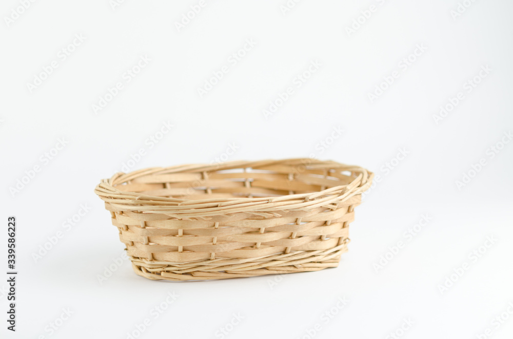 Empty wooden fruit or bread basket on white background