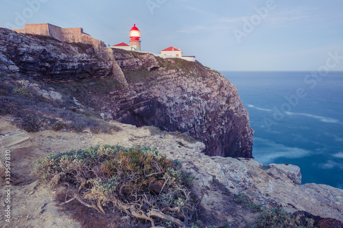 View of the lighthouse and cliffs at Cape St. Vincent at sunset. Continental Europe's most South-western point, Sagres, Algarve, Portugal.
