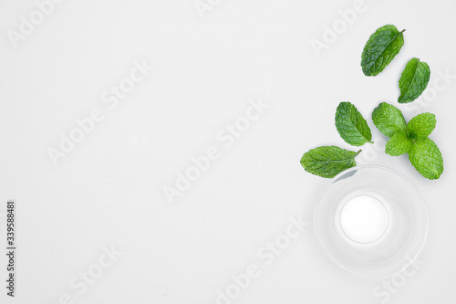 Glass bowl with fresh herbs - Mints isolated on white background.  For copy space.