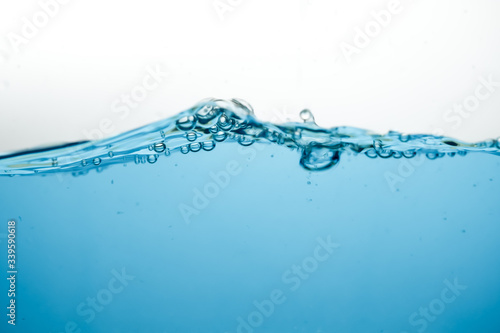 Wave and air bubbles on surface of water