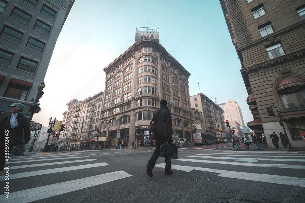 Fototapeta premium people walking on the street