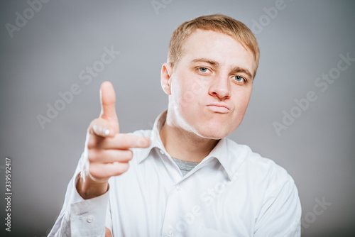 Canvas-taulu young man showing his forefinger