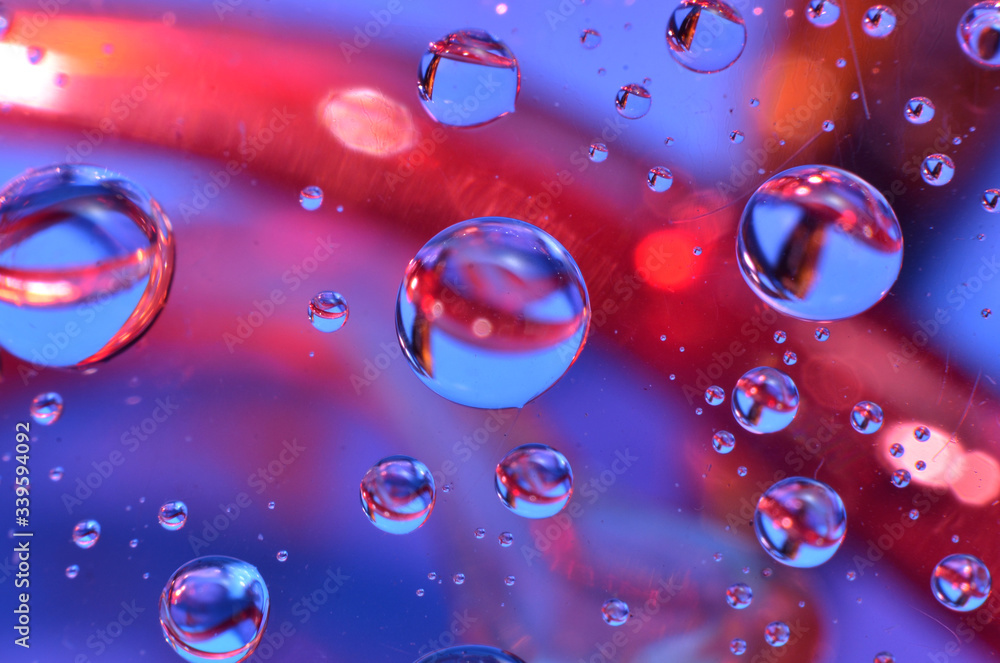 shiny clear water point attached to a glass reflects the same color as the color on the glass into a beautiful background as decoration shiny clear water point attached to a glass reflects the same color as the color on the glass into a beautiful background as decoration