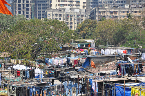 Mumbai, India-March 03,2013: Laundry Dhobi Ghat in Mumbai, people wash clothes on a city street. India's biggest wash.