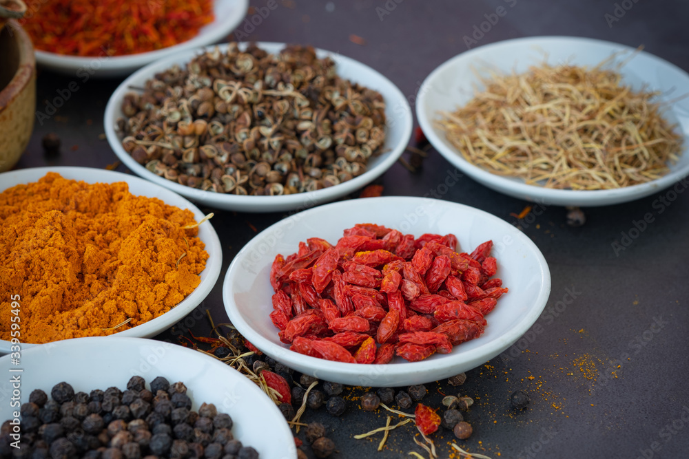 plate with spice on dark background.