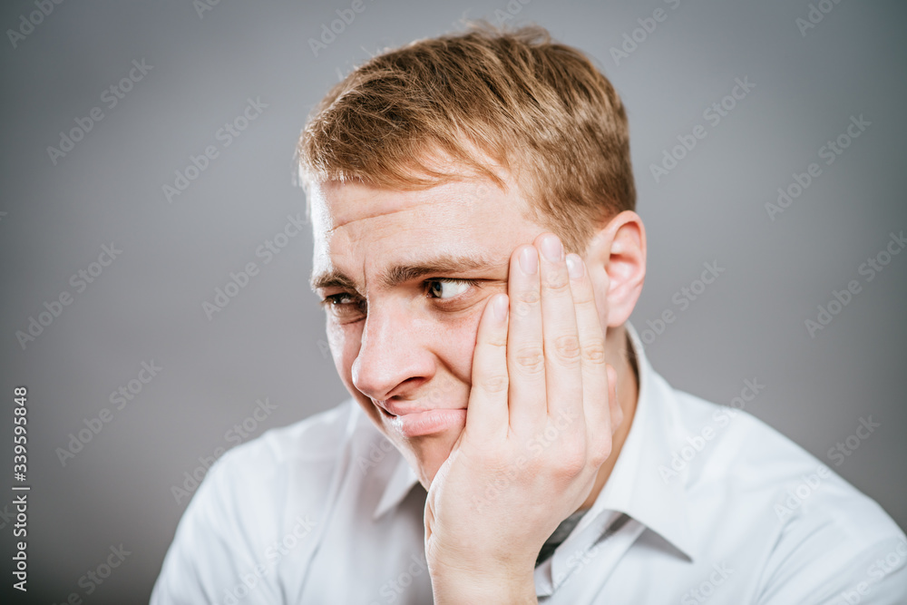 portrait of mature business man with hand on chin, looking at camera. head and shoulders, front view, copy space portrait of mature business man with hand on chin, looking at camera. head and shoulders, front view, copy space