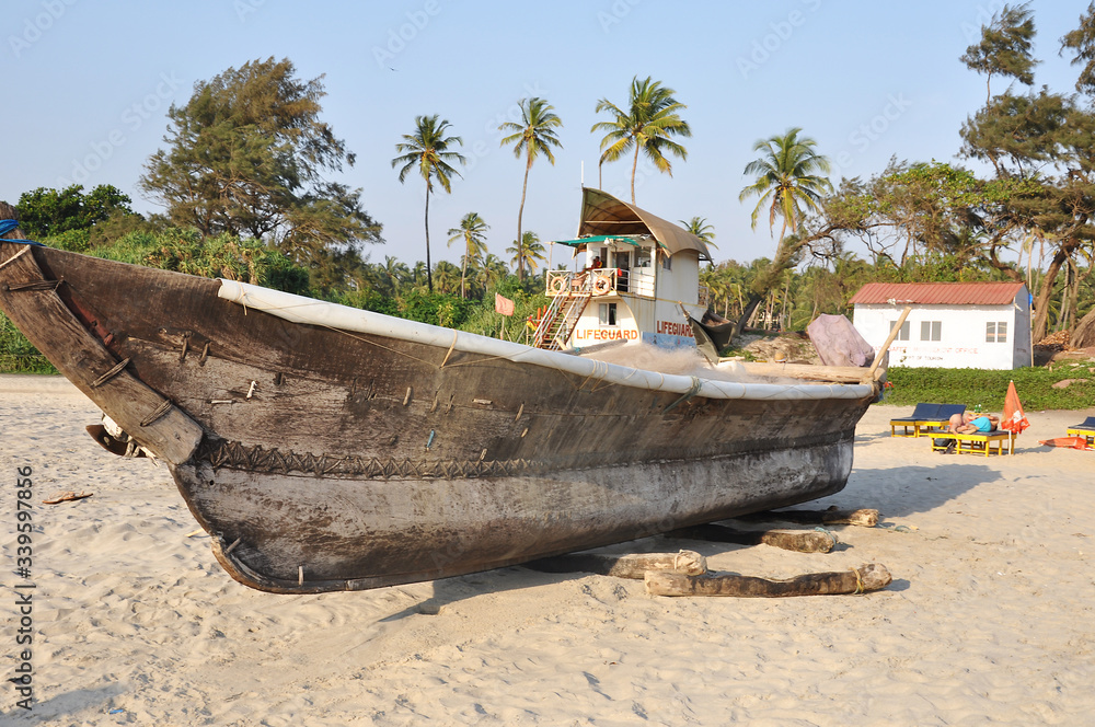 GOA, INDIA-MARCH 05,2013: old fishing boat on the beach in Goa, close-up