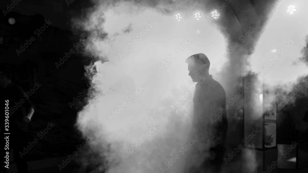 Man in the fog/smoke.