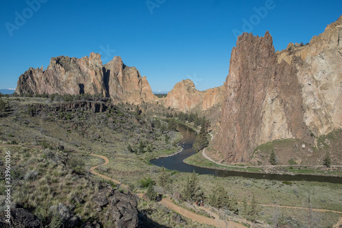 Wide view of valley surrounded by sheer rock cliffs