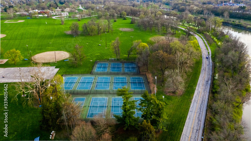 An aerial view of tennis courts in a public park