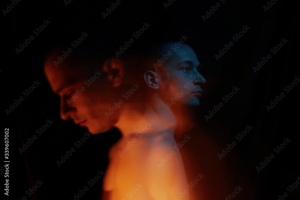 Personality disorder against black background with blurred face Personality disorder against black background with blurred face