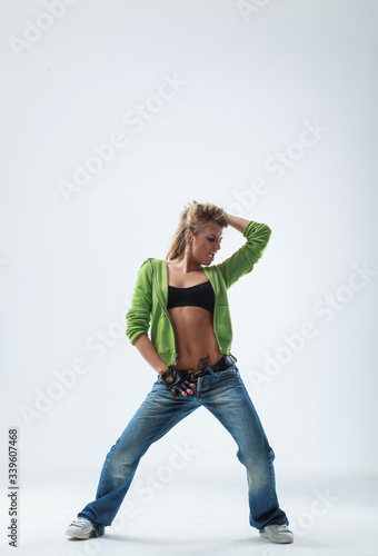 young woman jumping on studio backdrop