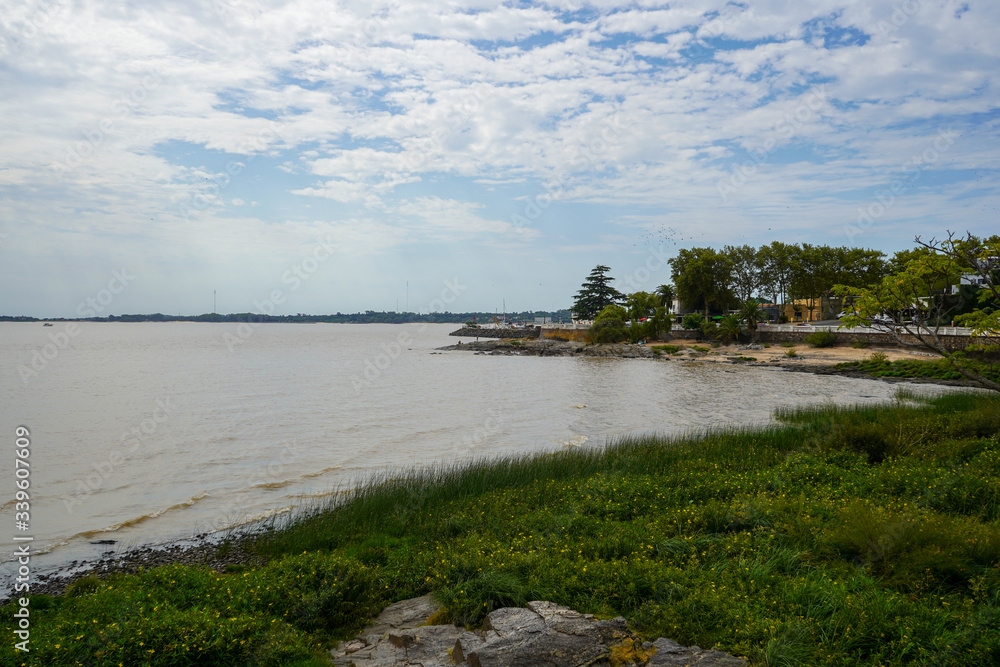 View of the Rio de La Plata from Colonia del Sacramento, near flag of Uruguay. March, 2020