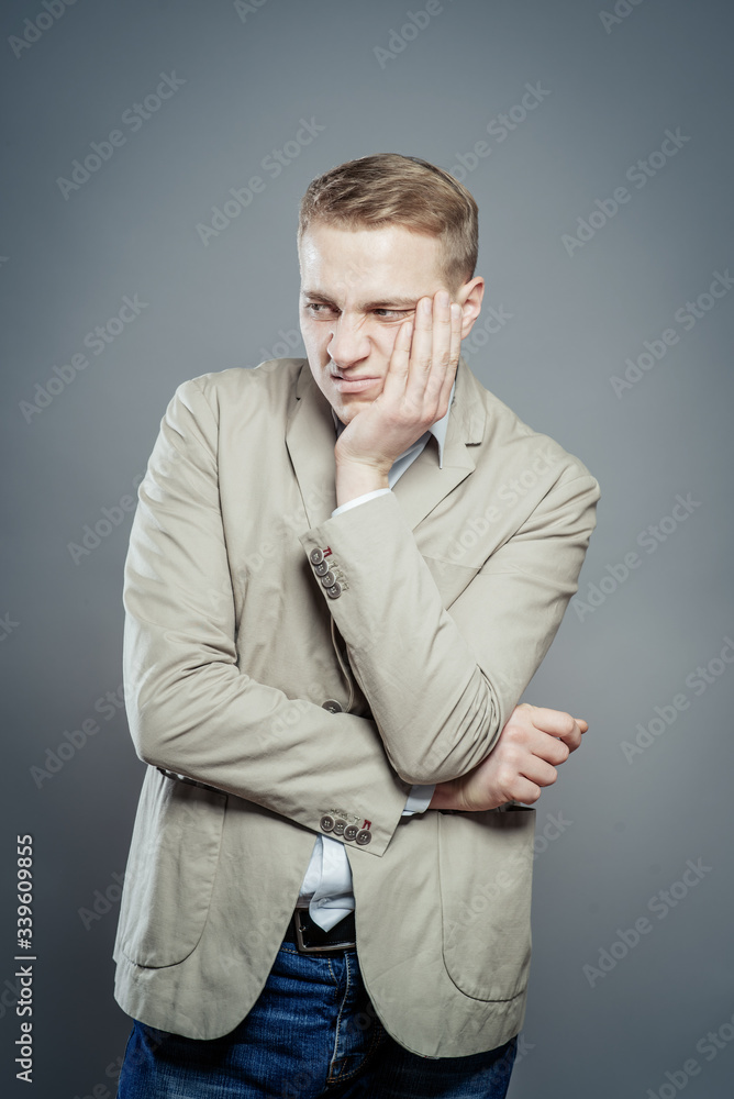 Bored young blond businessman in suit Bored young blond businessman in suit