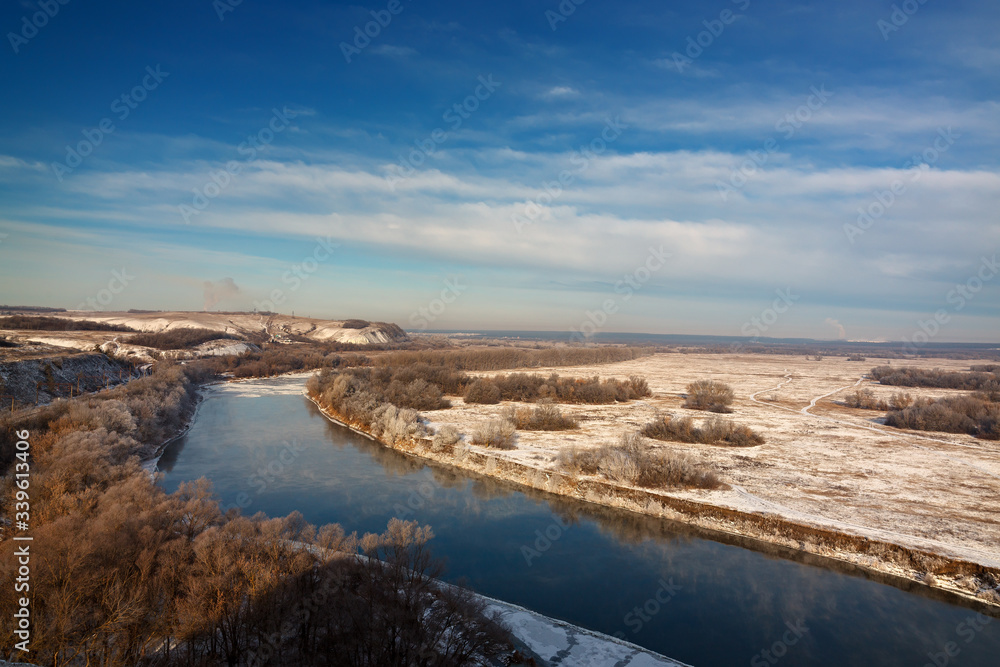 The first snow on the river, grass and trees. Autumn landscape in central Russia. The first snow on the river, grass and trees. Autumn landscape in central Russia.
