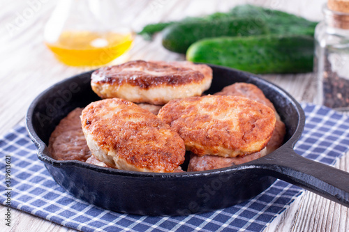 Chicken cutlets in frying pan. Healthy food