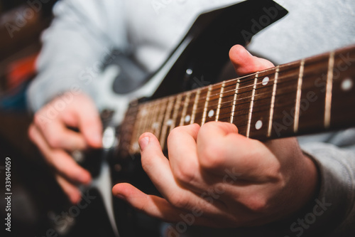 man playing electric guitar
