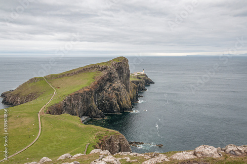 Neist Point lighthouse from Neist Cliff viewpoint. Concept: famous natural landscape, Scottish landscape, tranquility and serenity, power of the sea