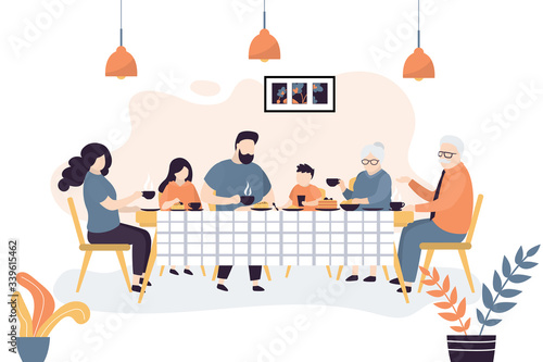The huge family is sitting at the table. People drink tea together and eat sweets. Family portrait banner.